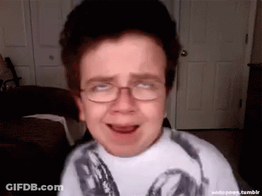 Boy Wearing Glasses Making Funny Face GIF