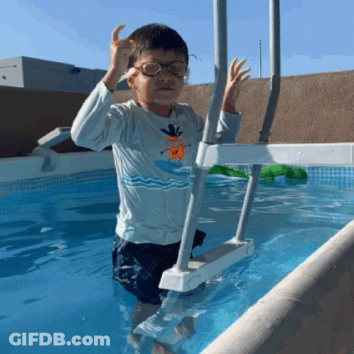 Boy Wearing Glasses Standing In Pool GIF