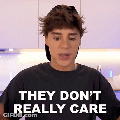 Boy Wearing Hat And Black Shirt Says They Don't Really Care GIF