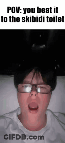 Boy Wearing Headphones Holding Phone GIF