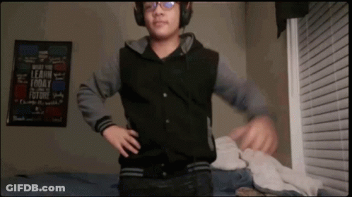 Boy Wearing Headphones In Front Of Learn Today Sign GIF