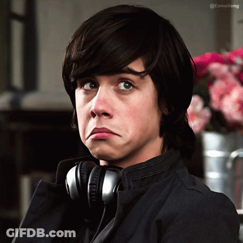 Boy Wearing Headphones Making Funny Face GIF