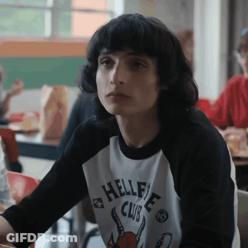 Boy Wearing Hellfire Club Shirt GIF