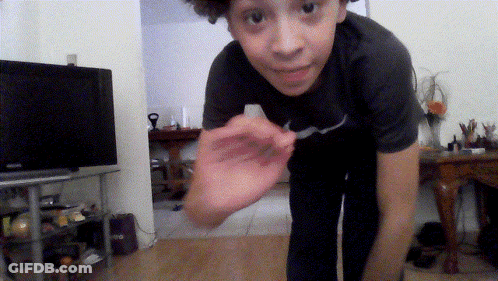 Boy Wearing Nike Shirt Standing In Front Of Television GIF