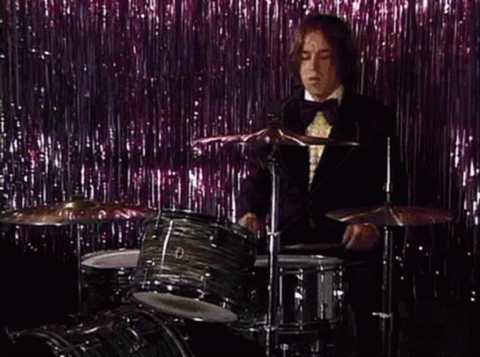 Boy Wearing Suit Playing Rim Shot GIF