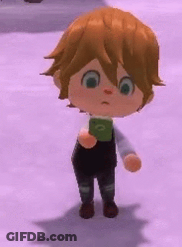 Boy With Brown Hair Holding Green Object GIF