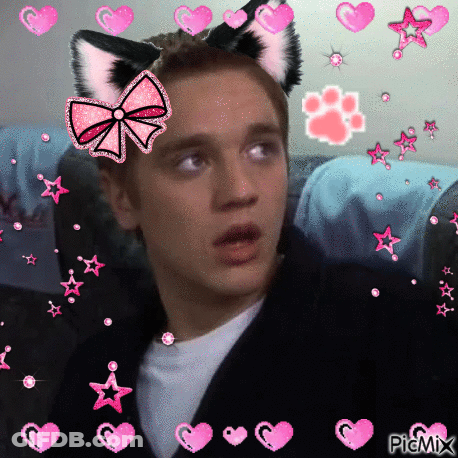 Boy With Cat Ears And Bow Surrounded By Hearts And Stars GIF