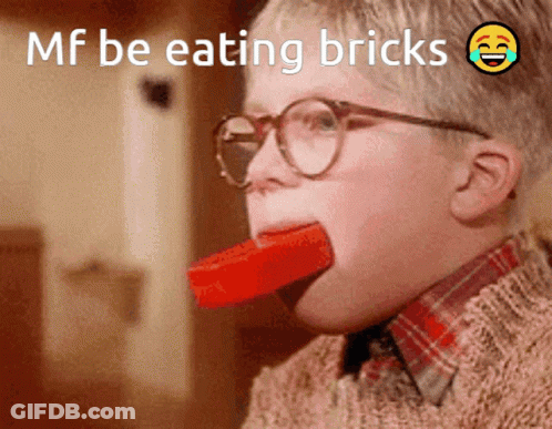 Boy With Glasses Eating Brick GIF