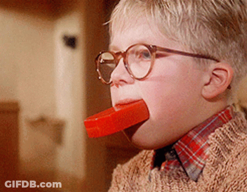 Boy With Glasses Eating Red Bar GIF