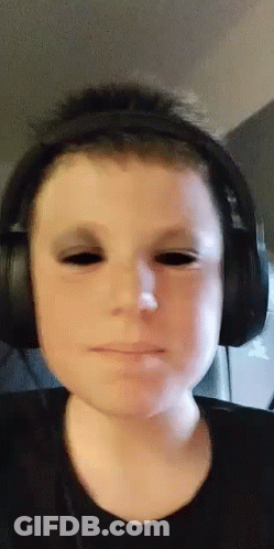 Boy With Headphones And Black Eyes Making Funny Face GIF