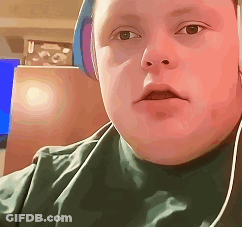 Boy With Headphones Looking At Camera GIF