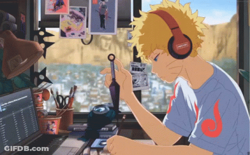 Boy With Headphones Sitting At Computer GIF