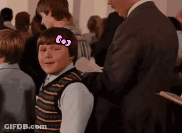 Boy With Hello Kitty Bow In Crowd GIF