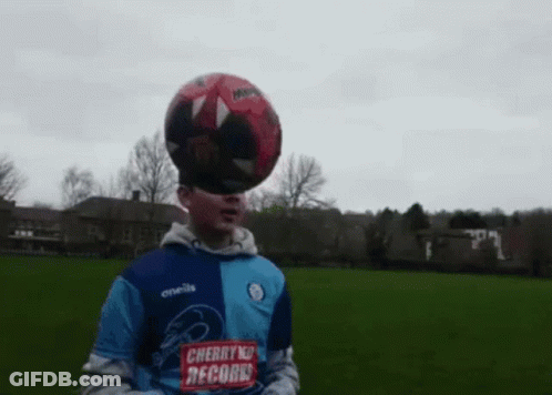 Boy With Soccer Ball On Head In Cherry Records Shirt GIF