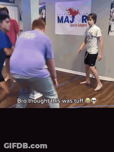 Boys Playing Game In Front Of Sports Banner GIF