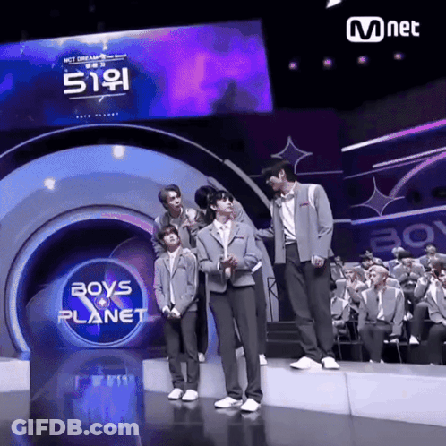 Boys Standing On Stage In Front Of Boys Planet Sign GIF