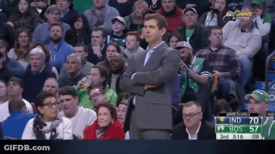 Brad Stevens Standing With Arms Tucked GIF