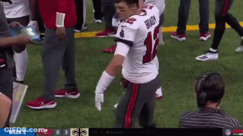 Brady Kneeling On Football Field GIF