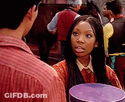 Braided Woman Holding Purple Box Talking To Man GIF