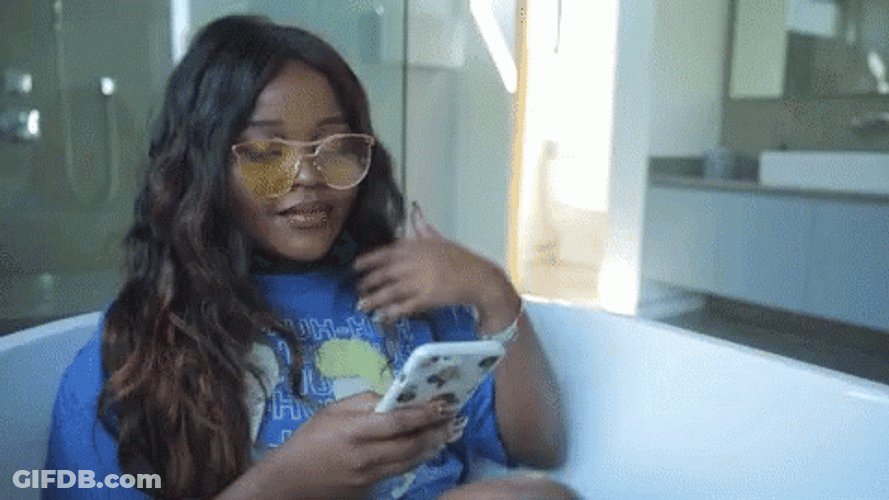Brassy Lady Texting Hair Flip GIF