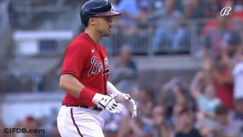 Braves Player Standing Before Scoreboard GIF