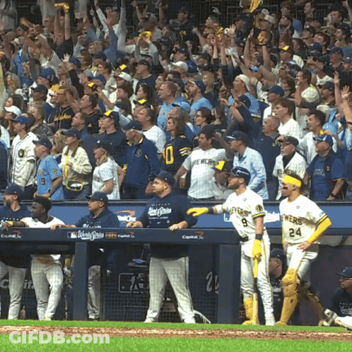 Brewers Baseball Players In Dugout Watching Game GIF