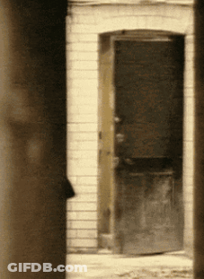 Brick Building With Open Door GIF