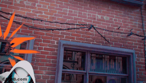 Brick Building With Window And Barbed Wire GIF
