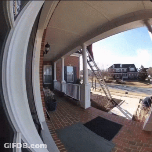 Brick House With Porch Saying Roofing GIF