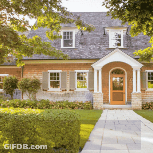 Brick House With Wooden Door And Shutters GIF