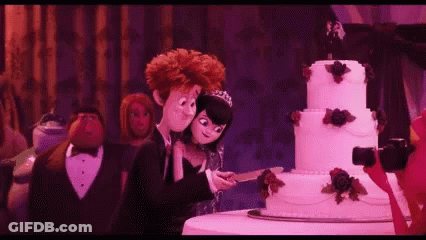 Bride And Groom Cutting Wedding Cake GIF