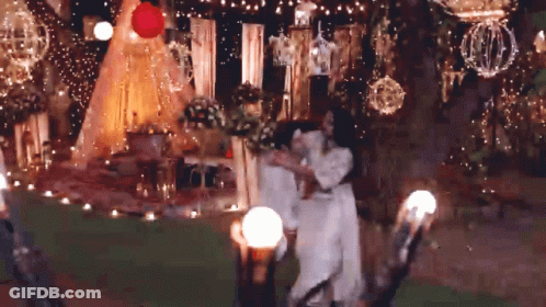 Bride And Groom Dancing At Decorated Table GIF