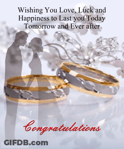 Bride And Groom Holding Hands On Hill Overlooking Lake GIF