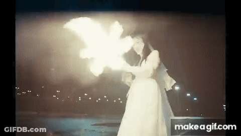 Bride And Groom Holding Torch GIF