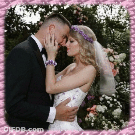 Bride And Groom Kissing In Front Of Pink Frame GIF