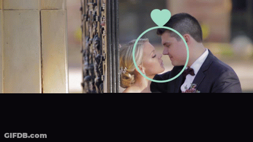 Bride And Groom Kissing With Green Heart GIF