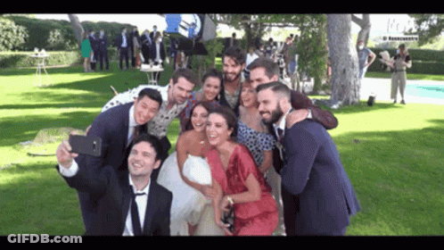 Bride And Groom Taking Selfie With Group GIF