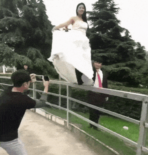 Bride Falls During Photoshoot GIF