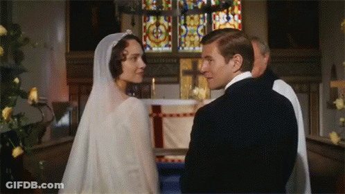 Bride Holding Champagne Saying I'm Getting Married GIF