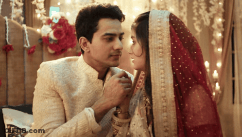 Bride In Red Veil And Groom Looking Into Eyes GIF