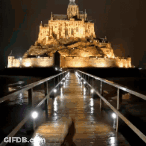 Bridge Leading To Castle At Night GIF