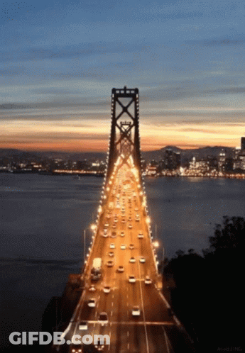 Bridge Over Water At Night GIF