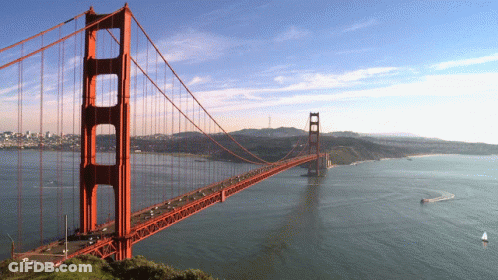 Bridge Over Water With Boat GIF