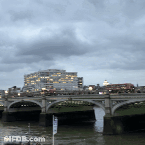 Bridge Over Water With Building And No Parking Sign GIF