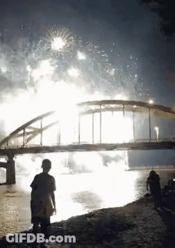 Bridge Over Water With Fireworks GIF