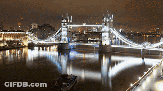 Bridge Over Water With Foreground Boat GIF