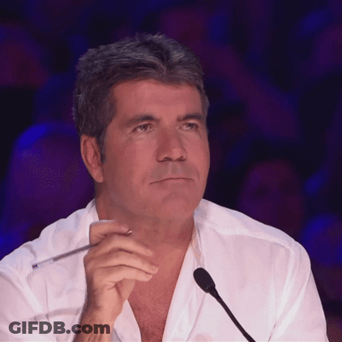 Britains Got Talent Simon Cowell Snickering GIF