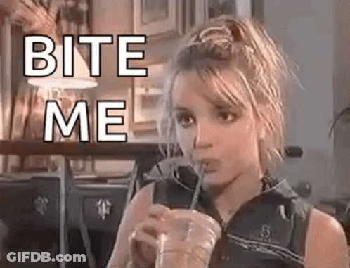 Britney Spears Is Drinking A Drink Through A Straw And Says `` Bite Me '' . GIF