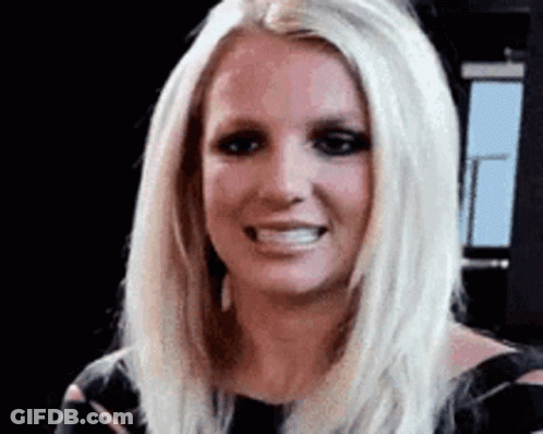 Britney Spears Is Smiling And Looking At The Camera . GIF