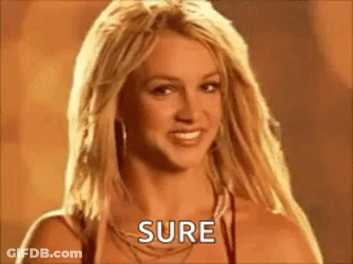 Britney Spears Is Smiling And Looking At The Camera While Wearing A Necklace And Earrings . GIF